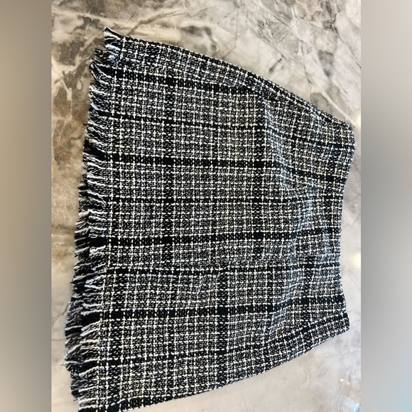 Mini woven skirt with fringe. Never worn. Thick but comfortable material. - Picture 2 of 4